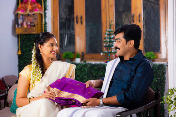 man gifting saree to wife